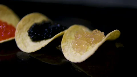 Three types of caviar black sturgeon paddlefish red chum salmon trout pink Stock Footage 302189098