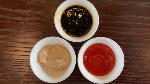 Three types of condiments, sweet soy sauce, tomato sauce, and mayonnaise Stock Footage 346837843