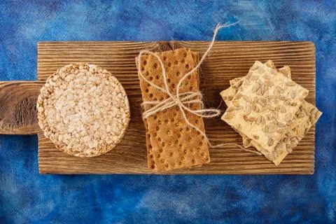 Three types of diet bread. Round buckwheat crispbread, wheat crispbread and c Stock Photos