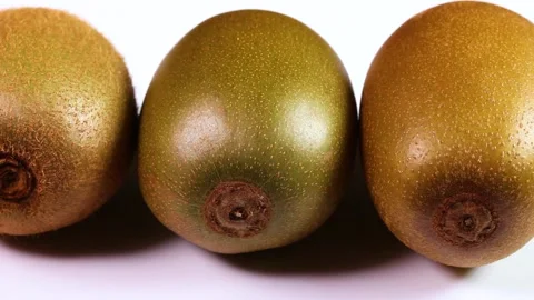 Three types of kiwi fruit rotating Stock Footage 310864938