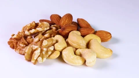 Three types of nuts on white background, rotating Stock-Footage 313815556