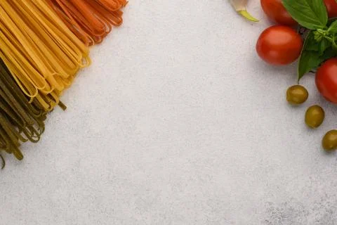 Three types of spaghetti and vegetables copy space. Stock Photos
