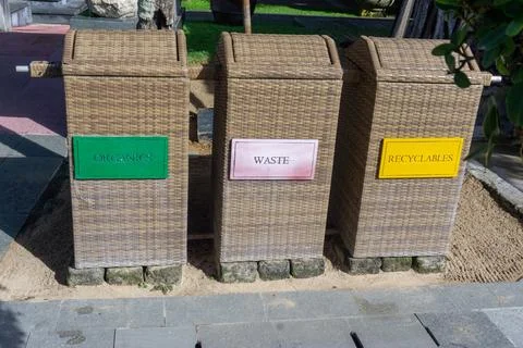 Three types of trash cans. "Organic", "Waste" and "Recyclables" Stock Photos