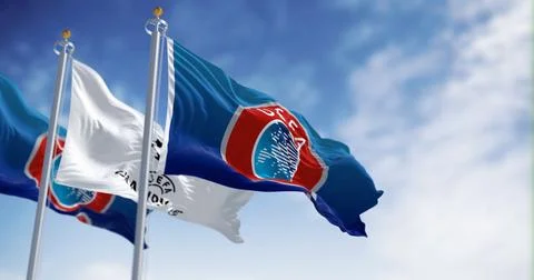 Three UEFA and UEFA Champions League flags waving Stock Illustration