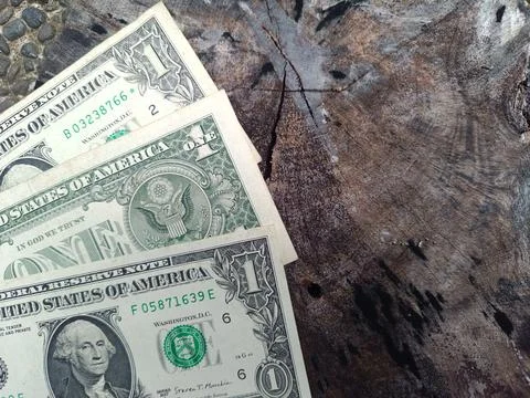 Three US 1 dollar banknotes. One dollar. US banknotes. Business concept. Stock Photos