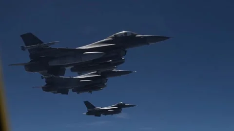 Three U.S. Air Force F-16 Fighting Falcon aircraft flying in formation Stock Footage 281555229
