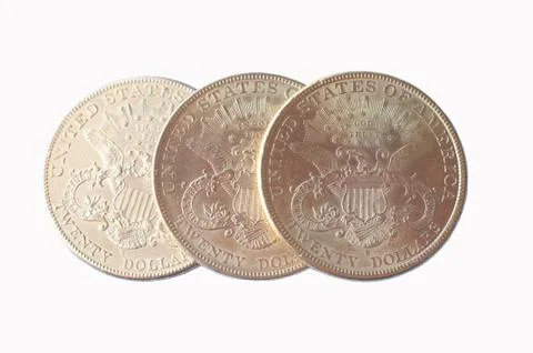 Three US American gold eagle one dollar coins on a white background Stock Photos