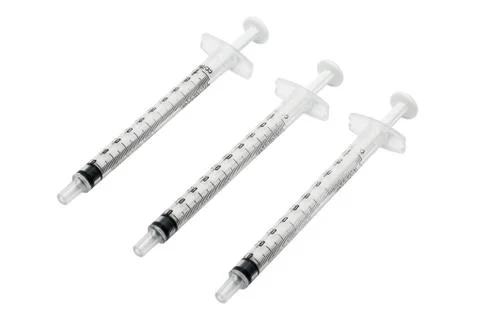 Three used syringes without needle isolated on white background Stock Photos
