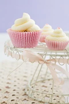 Three vanilla cupcakes Stock Photos