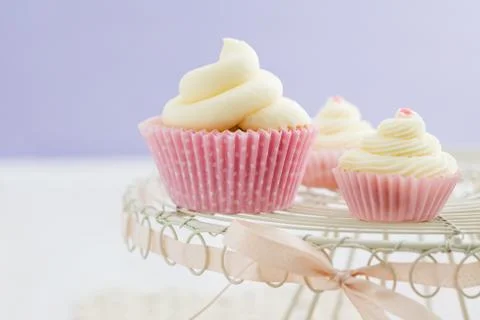 Three vanilla cupcakes Stock Photos
