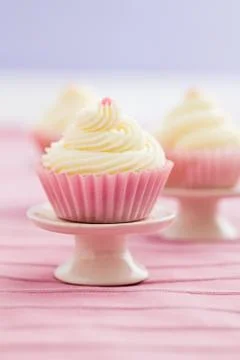 Three vanilla cupcakes Stock Photos