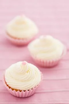 Three vanilla cupcakes Stock Photos