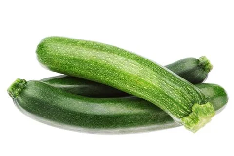 Three vegetable zucchini in a stack on a white background. Stock Photos