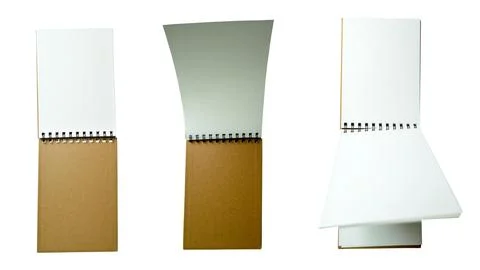 Three views of a small spiral-bound notebook with brown kraft cover and bla.. Stock-Fotos