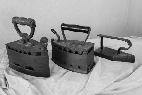 Three vintage irons Stock Photos