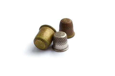 Three vintage thimbles isolated on a white background with shadow Stock Illustration