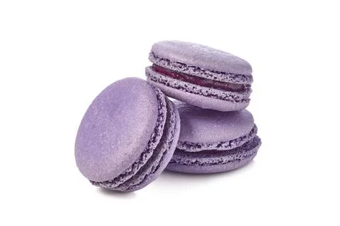 Three violet macarons on white background Stock Photos