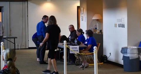 Three voters check in with three sitting poll workers Nov. 6, 2018 Stock-Footage 98142122