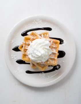 Three waffles on plate Stock Photos