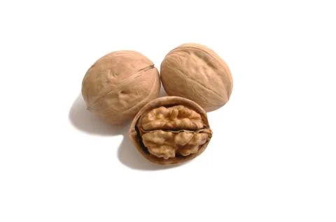 Three walnuts closeup on white isolate background Stock Photos