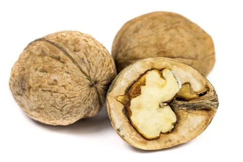 Three walnuts isolated on white background macro Stock Photos