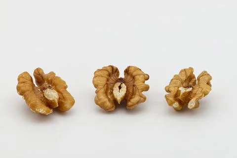 Three walnuts isolated on white background. Food texture concept Stock Photos