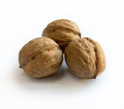 Three walnuts on white ackground Stock Photos