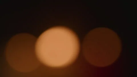 Three Warm Golden Bokeh Lights Blurred Background Abstract Night Scene Vidéo 335500588