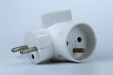 A three way adapter for connect another three cabels to one european socket Stock Photos