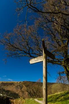 Three way finger post, pointing to Permissive Path, Thirlmere Loop. Stock Photos