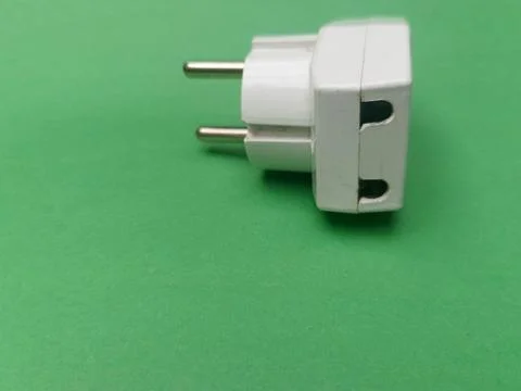 Three Way T Shaped Multi Plug Socket Adapter On Green Background Stock Photos
