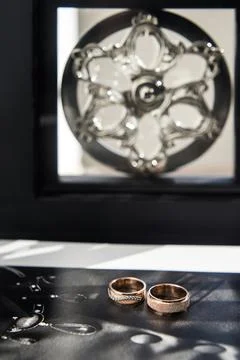 Three wedding ring on a black background Stock Photos