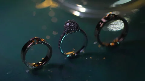 Three wedding rings on the table for diamond rings Stock Footage 156333465
