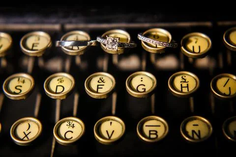 Three wedding rings on a typewriter Stock Photos