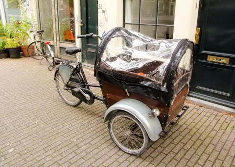 Three wheels bicycle with casing cover Stock Photos