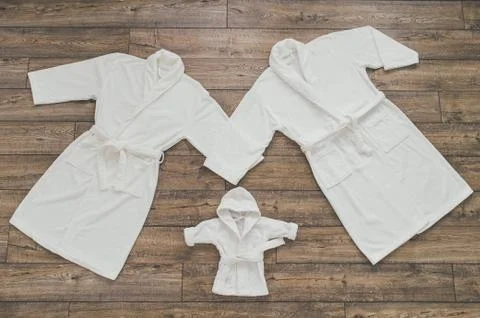 Three white Bathrobe Stock Photos