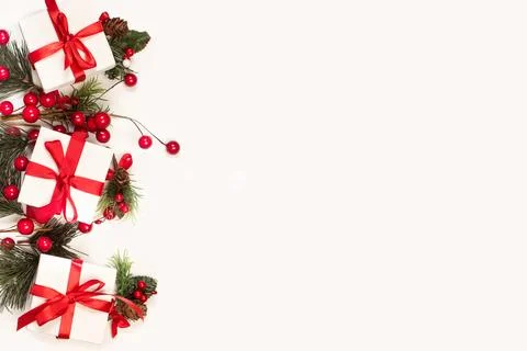 Three white boxes with red bows and christmas ornaments 스톡 사진