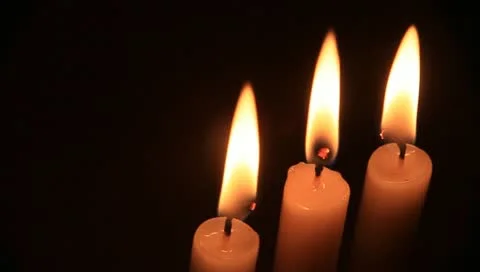 Three white candles on black Stock Footage 11022360
