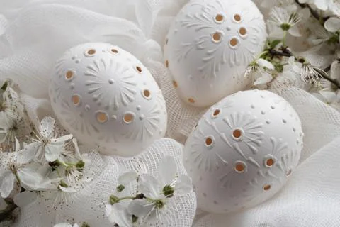 Three white Easter eggs decorated with wax Stock Photos