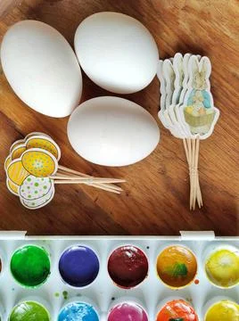 Three white eggs for Easter and an Easter bunny Stock Photos