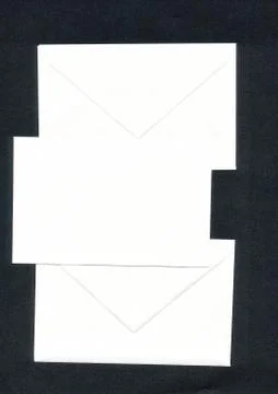 Three white envelopes, black background Stock Photos