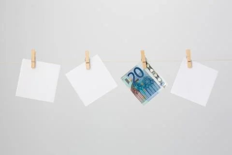 Three white notes and a twenty euro banknote Stock Photos