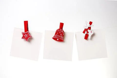 Three white notes with a red clothespin Stock Photos