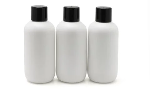 Three white plastic bottles Stock Photos