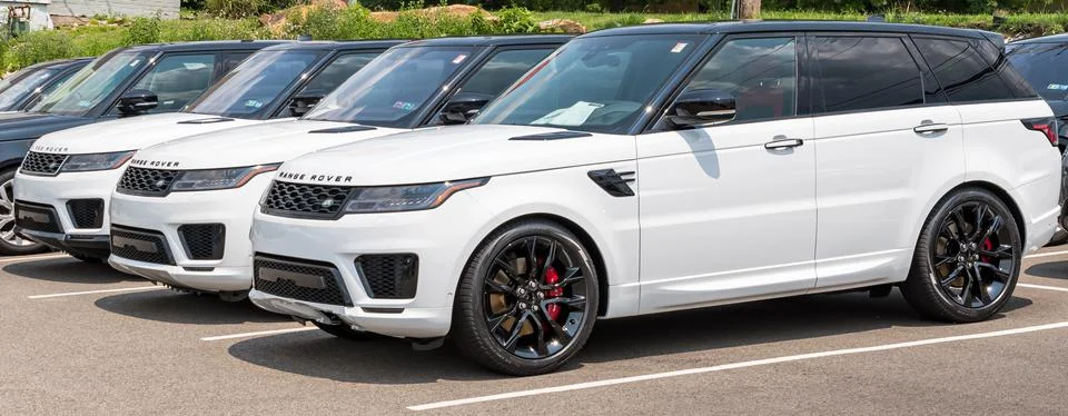 Three white Range Rover SUVs lined up Stock Photos