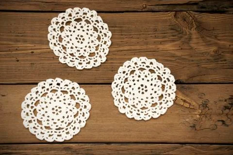 Three White Round Place Mat On Wooden Background Stock Photos