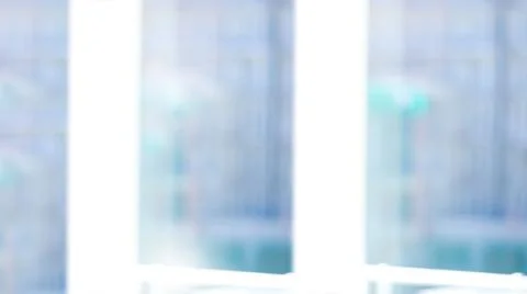 Three white vertical window frames are revealing blurred high-rise window grid Illustrazione stock