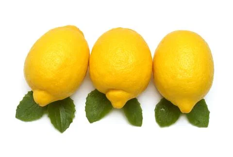 Three whole lemons fruit tropical with leaves isolated on white background... 库存照片