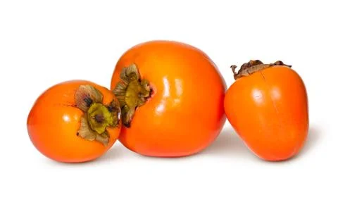 Three whole persimmons Stock Photos