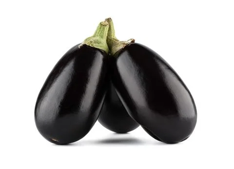 Three whole ripe eggplants on a white background. Stock Photos